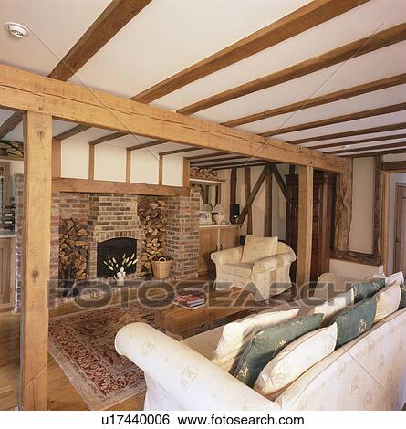 Patterned White Sofa And Armchair In Large Beamed Country Living