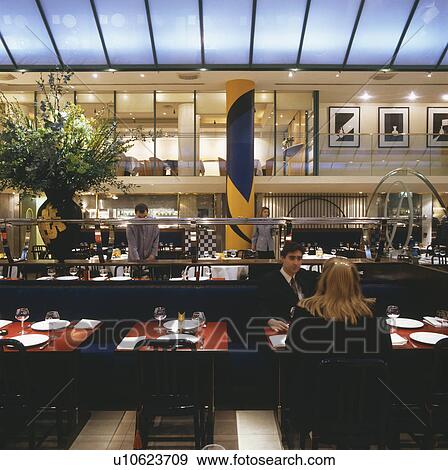 People dining at Quaglino's restaurant designed by Terence Conran in London View Large Photo Image Stock Photo - People dining at Quaglino's restaurant designed by Terence Conran in London. Fotosearch