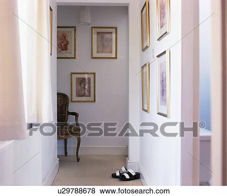 Pictures on walls of traditional white landing View Large Photo Image Stock Photo - Pictures on walls of traditional white landing. Fotosearch