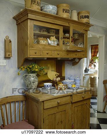 Pine Wall Cupboard And Small Dresser In Traditional Kitchen Stock