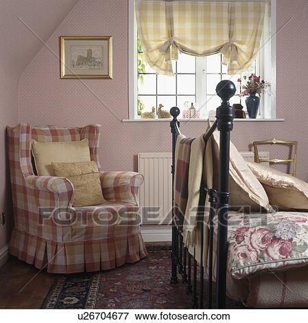 Pink checked armchair in pink cottage bedroom View Large Photo Image Stock Photo - Pink checked armchair in pink cottage bedroom. Fotosearch