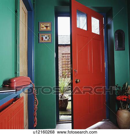 Pink front door in traditional green hall View Large Photo Image Stock Photo - Pink front door in traditional green hall. Fotosearch