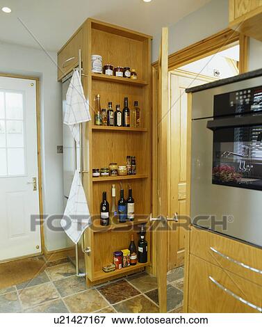 Pull-out storage shelves in modern kitchen View Large Photo Image Stock Photo - Pull-out storage shelves in modern kitchen. Fotosearch