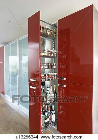 Pull-out storage shelves in red larder cupboard View Large Photo Image Picture - Pull-out storage shelves in red larder cupboard. Fotosearch