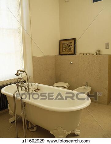 Stock Photo - Rolltop bath in modern bathroom. Fotosearch