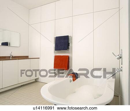 Rolltop bath in modern white bathroom View Large Photo Image Stock Image - Rolltop bath in modern white bathroom. Fotosearch