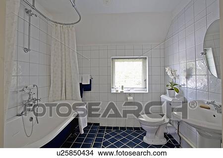 Rolltop Bath In White Tiled Bathroom With Black Floor Tiles Picture U25850434 Fotosearch