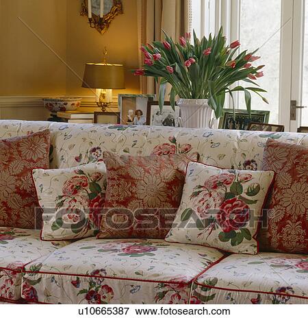 Rose-patterned sofa and cushions in traditional living room View Large Photo Image Stock Photo - Rose-patterned sofa and cushions in traditional living room. Fotosearch
