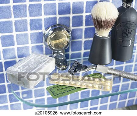 Shaving brush and soap on glass shelf on blue tiled wall View Large Photo Image Stock Photograph - Shaving brush and soap on glass shelf on blue tiled wall . Fotosearch