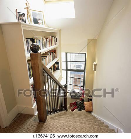 Shelves above staircase with sisal carpet View Large Photo Image Stock Photograph - Shelves above staircase with sisal carpet . Fotosearch