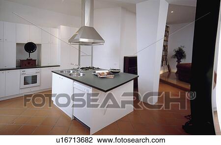 Slate-topped island unit with fitted sinks in modern white kitchen with quarry-tiled floor View Large Photo Image Stock Image - Slate-topped island unit with fitted sinks in modern white kitchen with quarry-tiled floor. Fotosearch