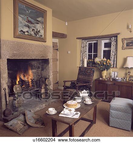 Stock Photo Of Small Table Set For Tea In Front Fireplace Stock Photo Of Small Table Set For Tea