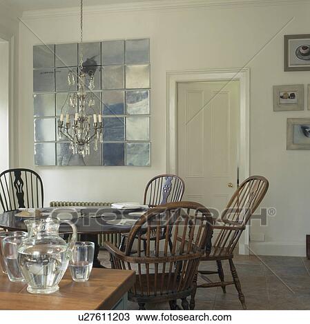 Square mirror tiled sculpture in white dining room with antique Windsor chairs View Large Photo Image Stock Image - Square mirror tiled sculpture in white dining room with antique Windsor chairs. Fotosearch