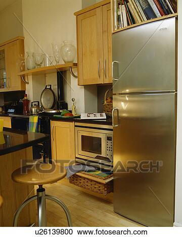 Stainless steel fridge-freezerin modern kitchen View Large Photo Image Stock Image - Stainless steel fridge-freezerin modern kitchen. Fotosearch