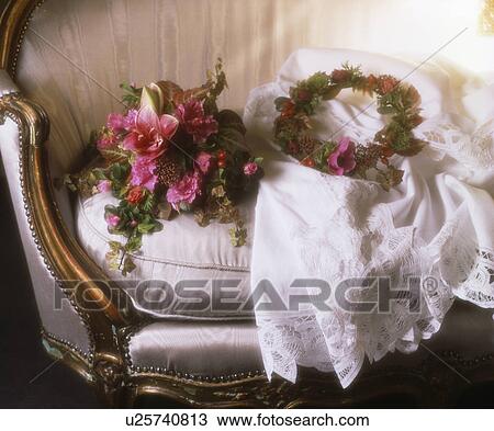 Stock Image - Still-Life of bridesmaid's bouquet of pink lilies and fresh floral head-piece. Fotosearch