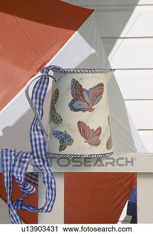 Still-Life of butterfly decoupage jug and blue checked ribbon View Large Photo Image Stock Image - Still-Life of butterfly decoupage jug and blue checked ribbon. Fotosearch