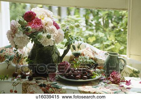 Still-life of pink and cream roses in jug View Large Photo Image Stock Photography - Still-life of pink and cream roses in jug . Fotosearch