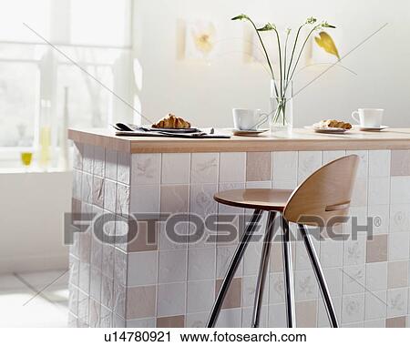 Stool at tiled peninsular unit in economy-style kitchen View Large Photo Image Stock Image - Stool at tiled peninsular unit in economy-style kitchen. Fotosearch