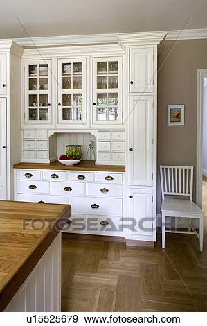 Swedish oak strip parquet flooring in country kitchen with painted tulip-wood fitted dresser View Large Photo Image Stock Photo - Swedish oak strip parquet flooring in country kitchen with painted tulip-wood fitted dresser. Fotosearch