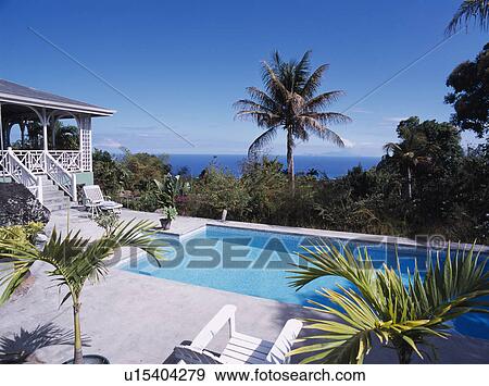 Stock Photo - Swimming pool of Caribbean house with view of the ocean. Fotosearch