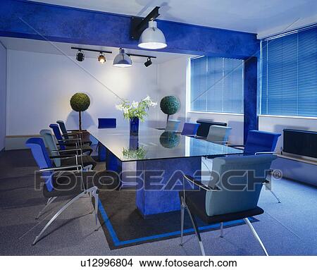 Table and chairs in modern blue board room View Large Photo Image Picture - Table and chairs in modern blue board room. Fotosearch