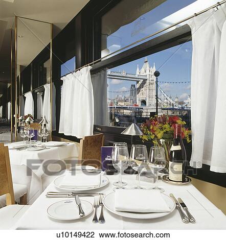 Table set for lunch in front of window at the Pont de la Tour restaurant in London with view of Tower Bridge View Large Photo Image Stock Image - Table set for lunch in front of window at the Pont de la Tour restaurant in London with view of Tower Bridge. Fotosearch