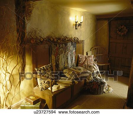 Tapestry cushions piled on wooden settle in country hall View Large Photo Image Picture - Tapestry cushions piled on wooden settle in country hall. Fotosearch