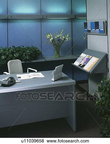 Telephone on grey desk in small modern office View Large Photo Image Stock Photo - Telephone on grey desk in small modern office. Fotosearch