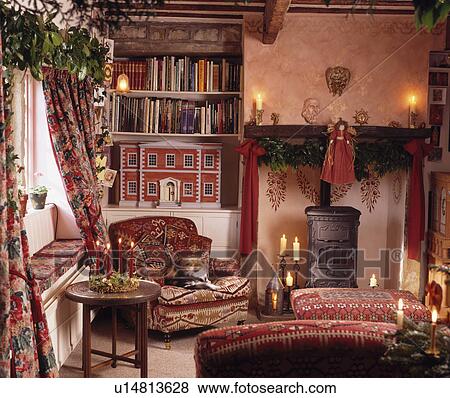Stock Photo - Traditional cottage living room decorated for Christmas. Fotosearch
