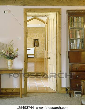 Picture - Traditional cream hall with open door to kitchen. Fotosearch