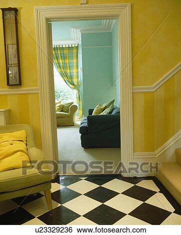 Stock Photograph - Traditional cream hall with chequerboard flooring. Fotosearch
