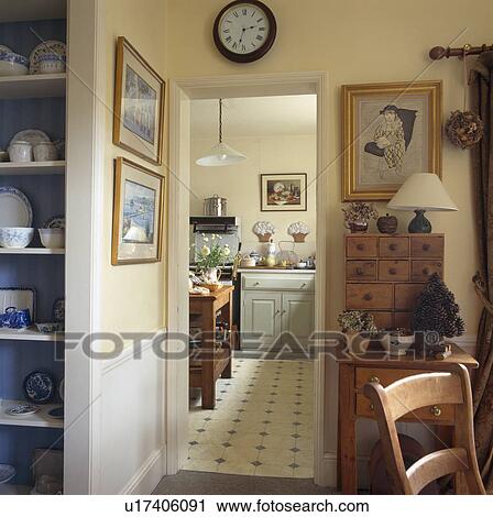 Traditional dining room with open door to kitchen with vinyl flooring View Large Photo Image Stock Image - Traditional dining room with open door to kitchen with vinyl flooring. Fotosearch