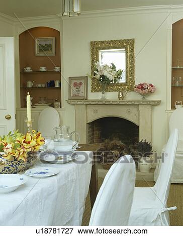 Traditional dining room with white cloth on table set for lunch View Large Photo Image Stock Photo - Traditional dining room with white cloth on table set for lunch. Fotosearch