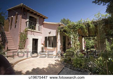 Traditional pastel pink house on Mallorca View Large Photo Image Stock Photo - Traditional pastel pink house on Mallorca. Fotosearch