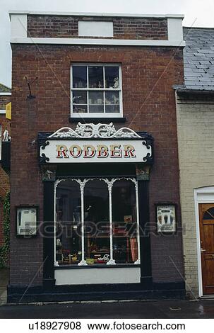 Stock Photo - Traditional shop with painted shop sign. Fotosearch