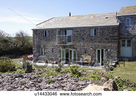 Stock Photograph - Traditional stone-built house on the Cornish coast. Fotosearch