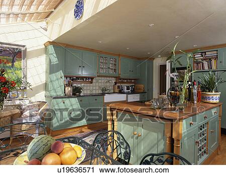 Turquoise island unity and fitted cupboards in kitchen extension View Large Photo Image Stock Image - Turquoise island unity and fitted cupboards in kitchen extension. Fotosearch