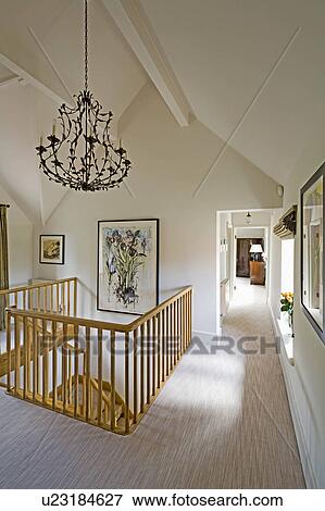 Unusual metal light on cream country landing with beige carpet View Large Photo Image Stock Photo - Unusual metal light on cream country landing with beige carpet. Fotosearch