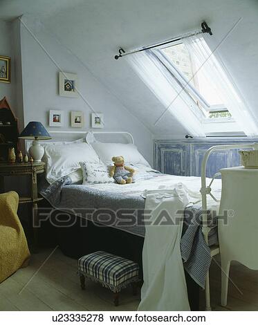 Velux window above bed in attic bedroom View Large Photo Image Stock Photo - Velux window above bed in attic bedroom. Fotosearch