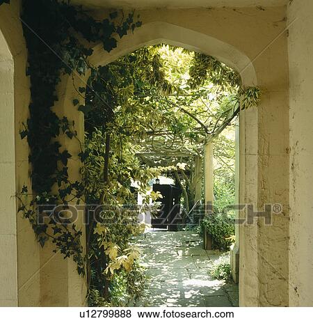 View through arched porch of courtyard garden View Large Photo Image Stock Photo - View through arched porch of courtyard garden. Fotosearch