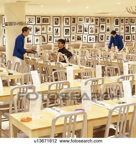 Waiters in modern London restaurant with black and white photographs lining the wall View Large Photo Image Stock Image - Waiters in modern London restaurant with black and white photographs lining the wall. Fotosearch