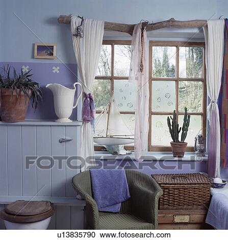 White curtains on driftwood pole in small pastel blue bathroom View Large Photo Image Stock Image - White curtains on driftwood pole in small pastel blue bathroom. Fotosearch
