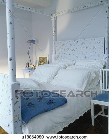 White pillows and bedlinen on handpainted four-poster bed in pastel blue bedroom View Large Photo Image Stock Image - White pillows and bedlinen on handpainted four-poster bed in pastel blue bedroom. Fotosearch