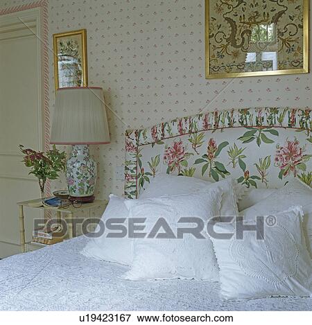 White pillows on bed with upholstered floral headboard View Large Photo Image Stock Photo - White pillows on bed with upholstered floral headboard. Fotosearch