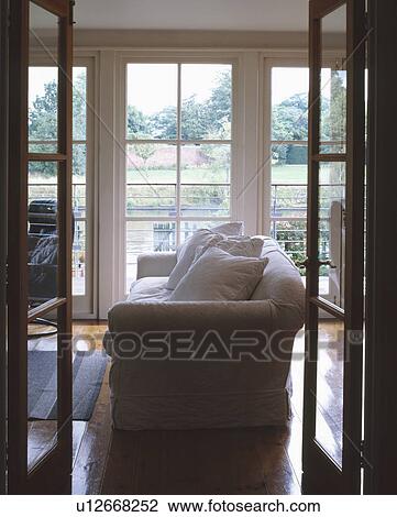 White sofa in modern townhouse living room View Large Photo Image Stock Image - White sofa in modern townhouse living room. Fotosearch