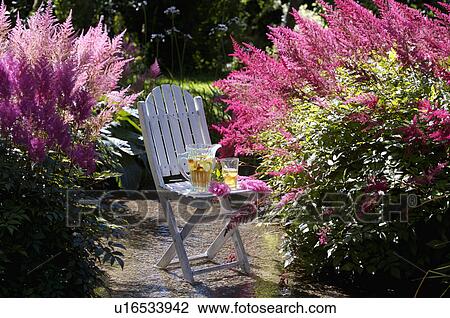 White table and chairs in grassy corner of rough mown lawn. View Large Photo Image Stock Image - White table and chairs in grassy corner of rough mown lawn.. Fotosearch
