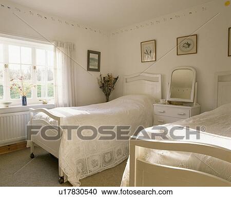 White twin beds in white bedroom View Large Photo Image Stock Image - White twin beds in white bedroom. Fotosearch