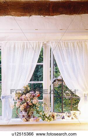 White voile curtains at cottage bedroom window with pink roses on windowsill View Large Photo Image Stock Photograph - White voile curtains at cottage bedroom window with pink roses on windowsill. Fotosearch