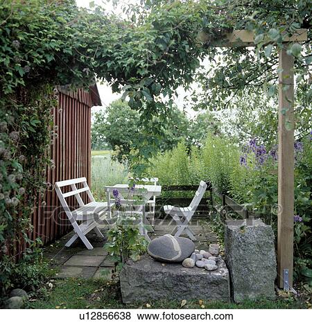 Stock Photo -  White Wooden Garden Furniture.. Fotosearch