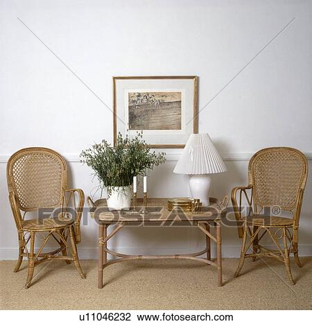 Wicker+bamboo chairs and small table in apartment hall View Large Photo Image Stock Image - Wicker+bamboo chairs and small table in apartment hall. Fotosearch